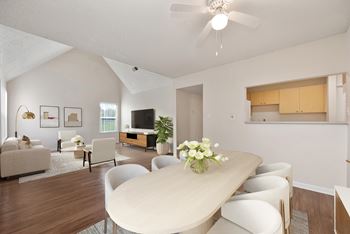 A living room with a white couch and a coffee table.